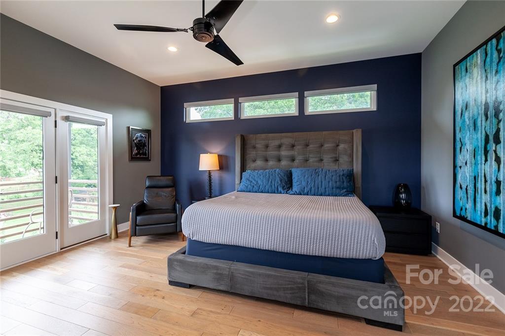 1505 Parson Street Charlotte, NC 28205 - Photo 22 of 48 a bedroom with a bed and large windows