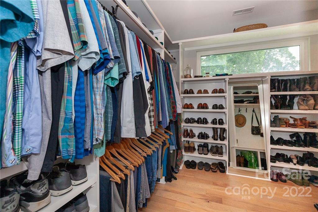 1505 Parson Street Charlotte, NC 28205 - Photo 28 of 48 a view of walk in closet with clothes and shoes