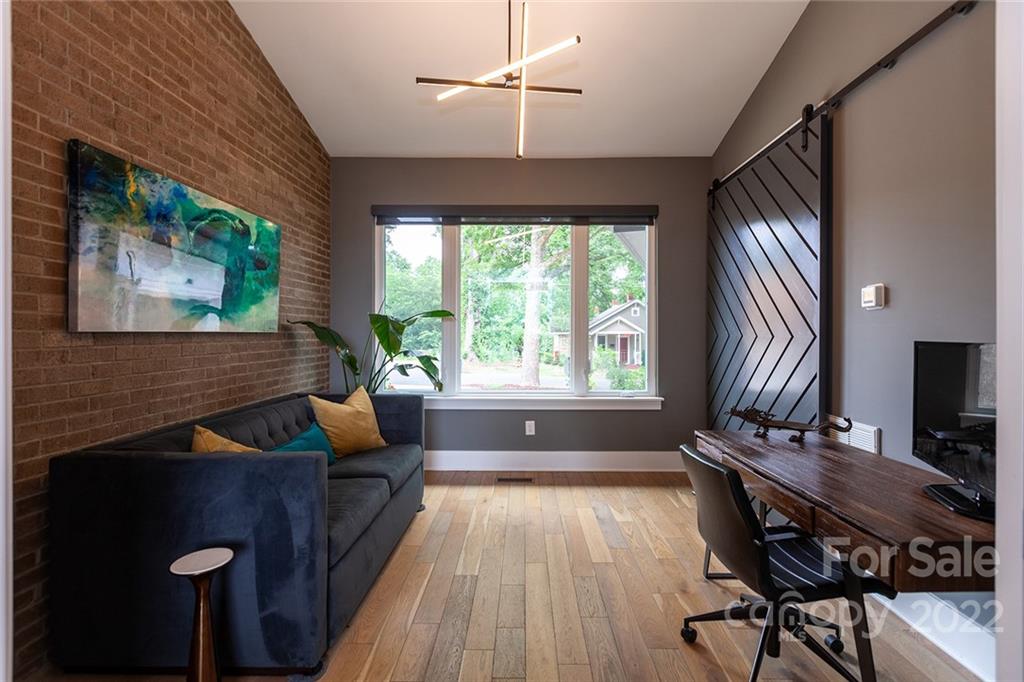 1505 Parson Street Charlotte, NC 28205 - Photo 33 of 48 a living room with furniture and a flat screen tv