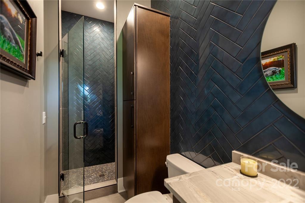 1505 Parson Street Charlotte, NC 28205 - Photo 40 of 48 a bathroom with a granite countertop sink and a mirror