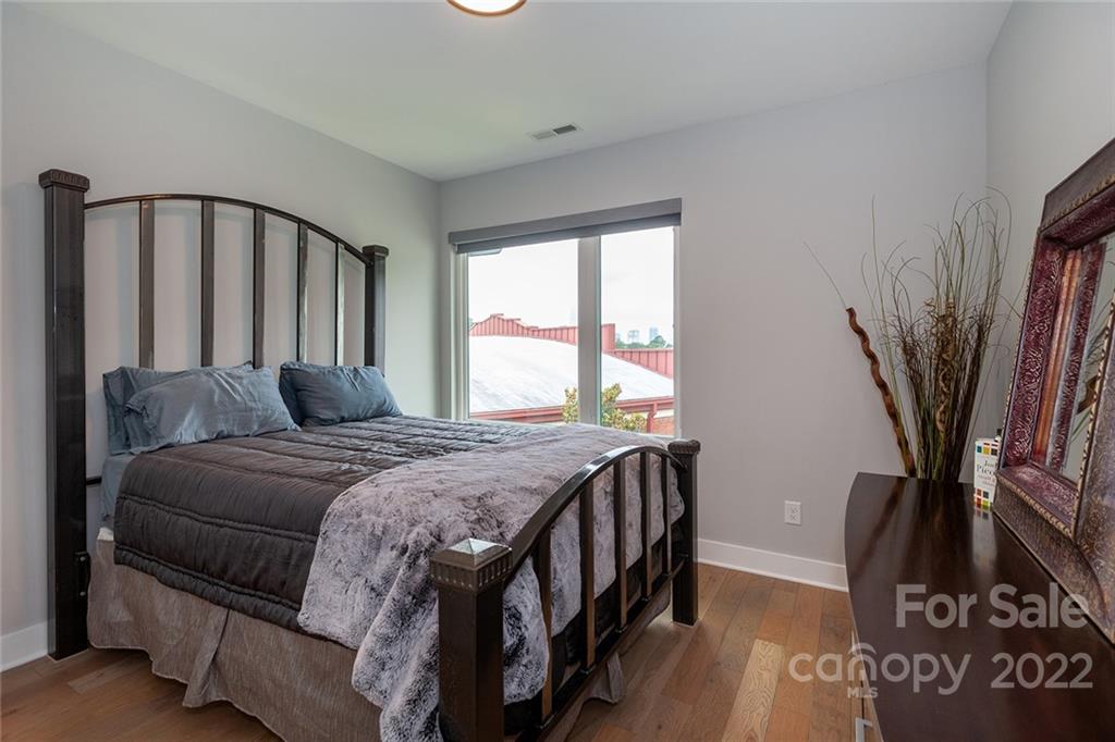 1505 Parson Street Charlotte, NC 28205 - Photo 43 of 48 a bedroom with a bed next to a large window