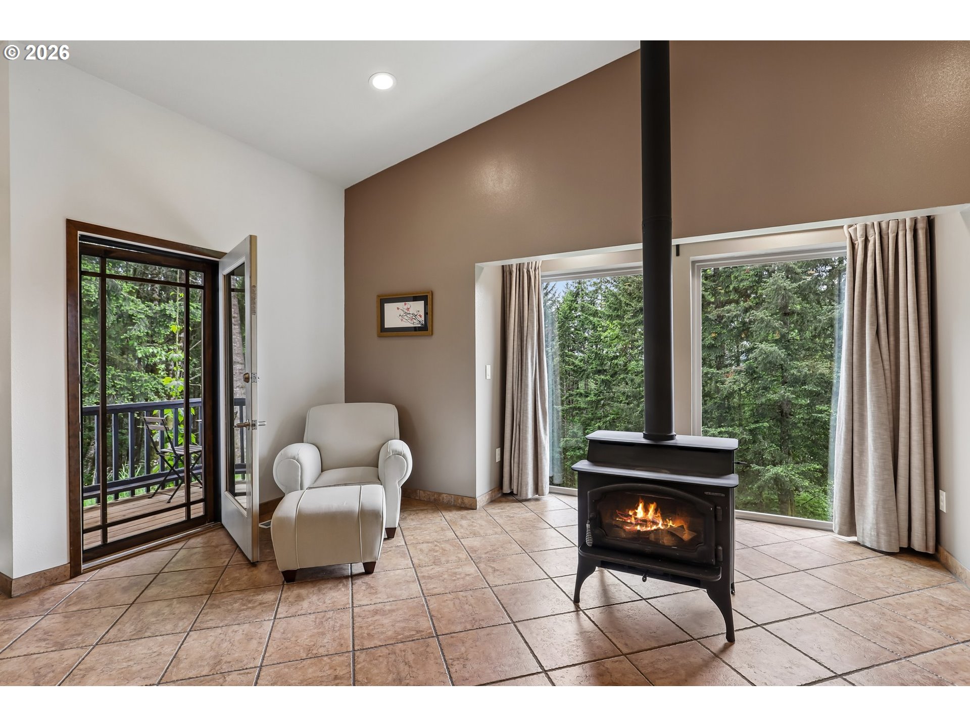 873 Mountain View Road Kalama, WA 98625 - Photo 8 of 45 a living room with furniture and a floor to ceiling window