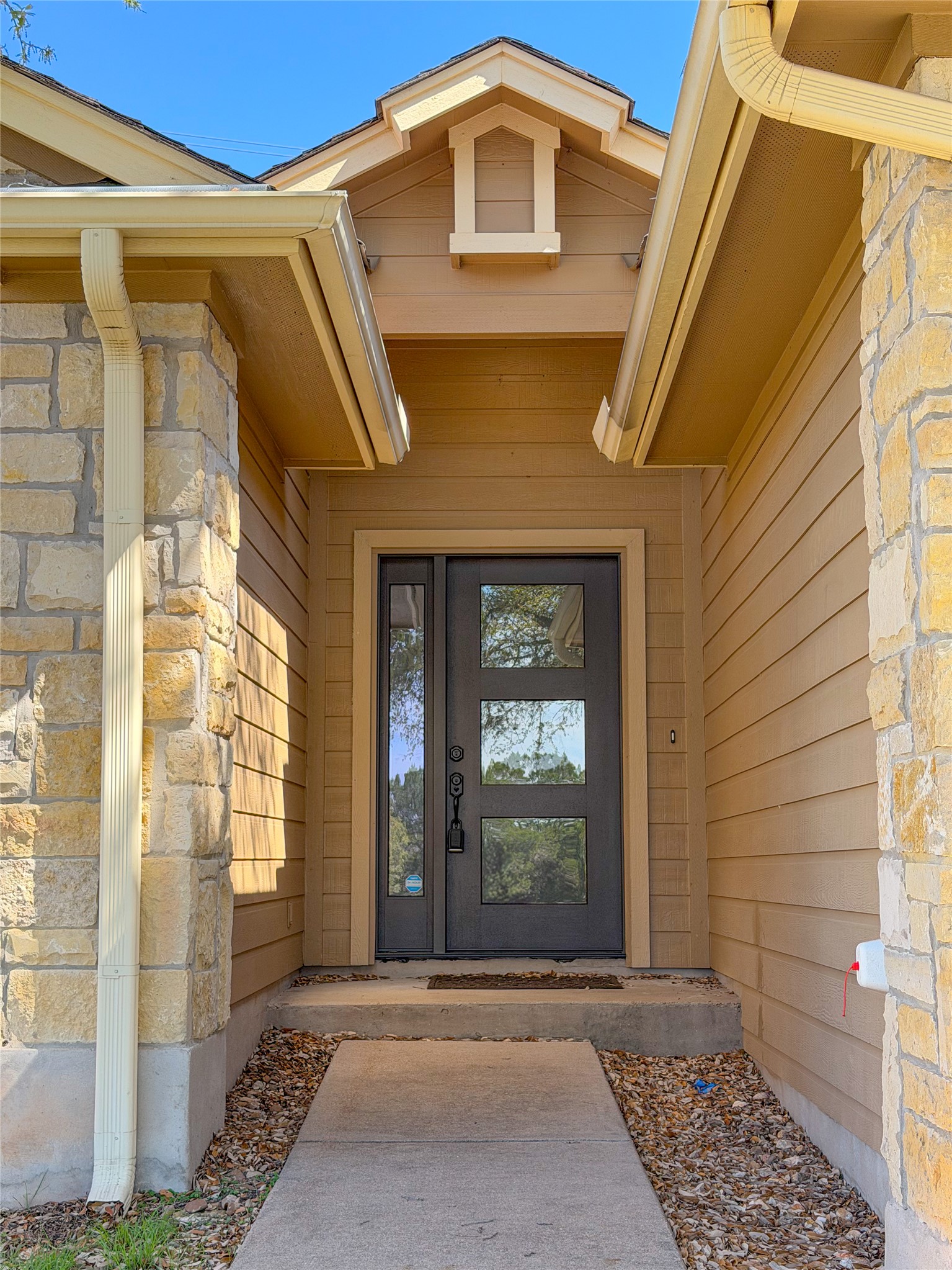 430 Summit Ridge Drive North Point Venture, TX 78645 - Photo 2 of 39 Entrance to property with stone siding