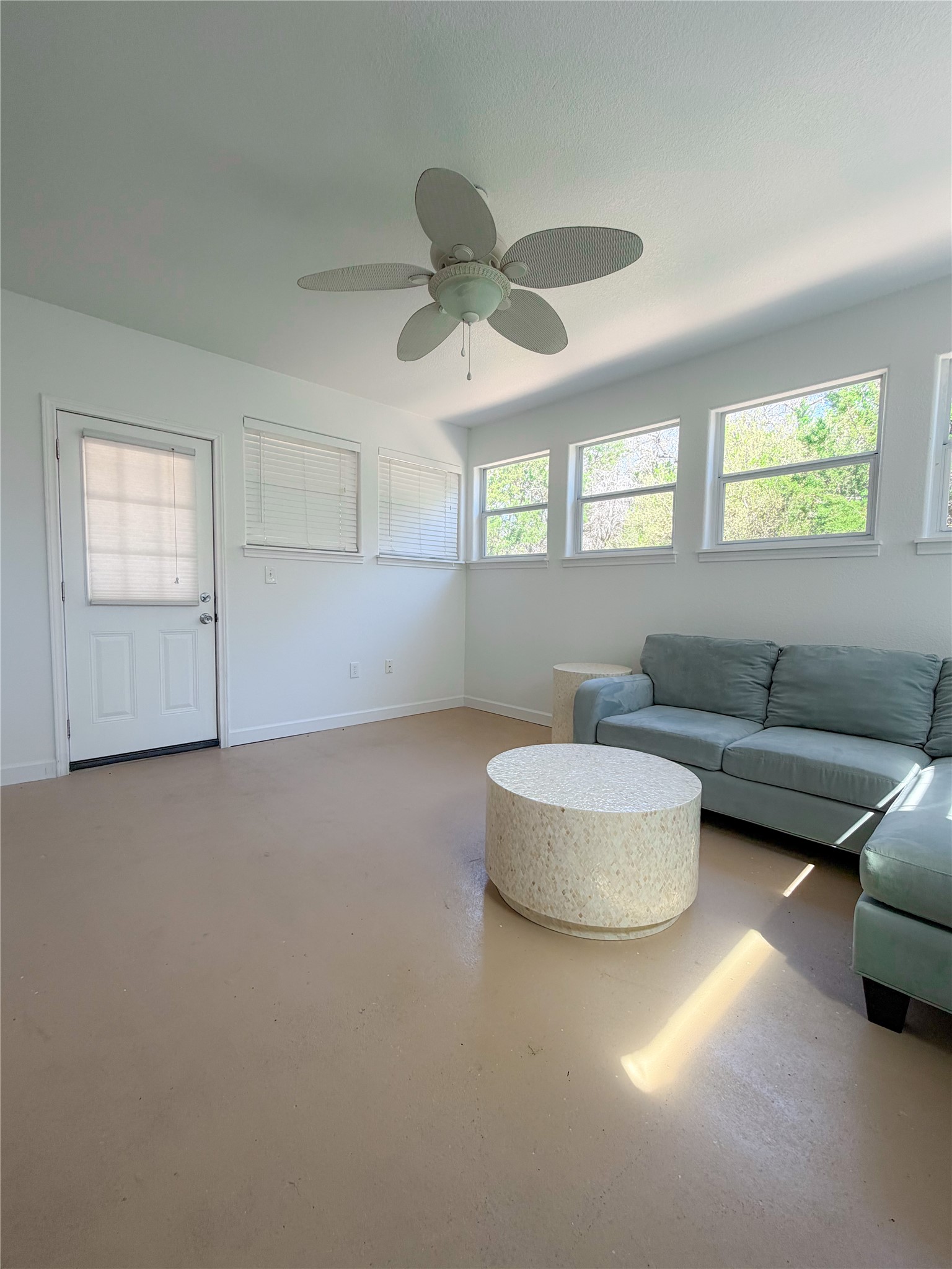 430 Summit Ridge Drive North Point Venture, TX 78645 - Photo 20 of 39 Living area featuring concrete floors and ceiling fan