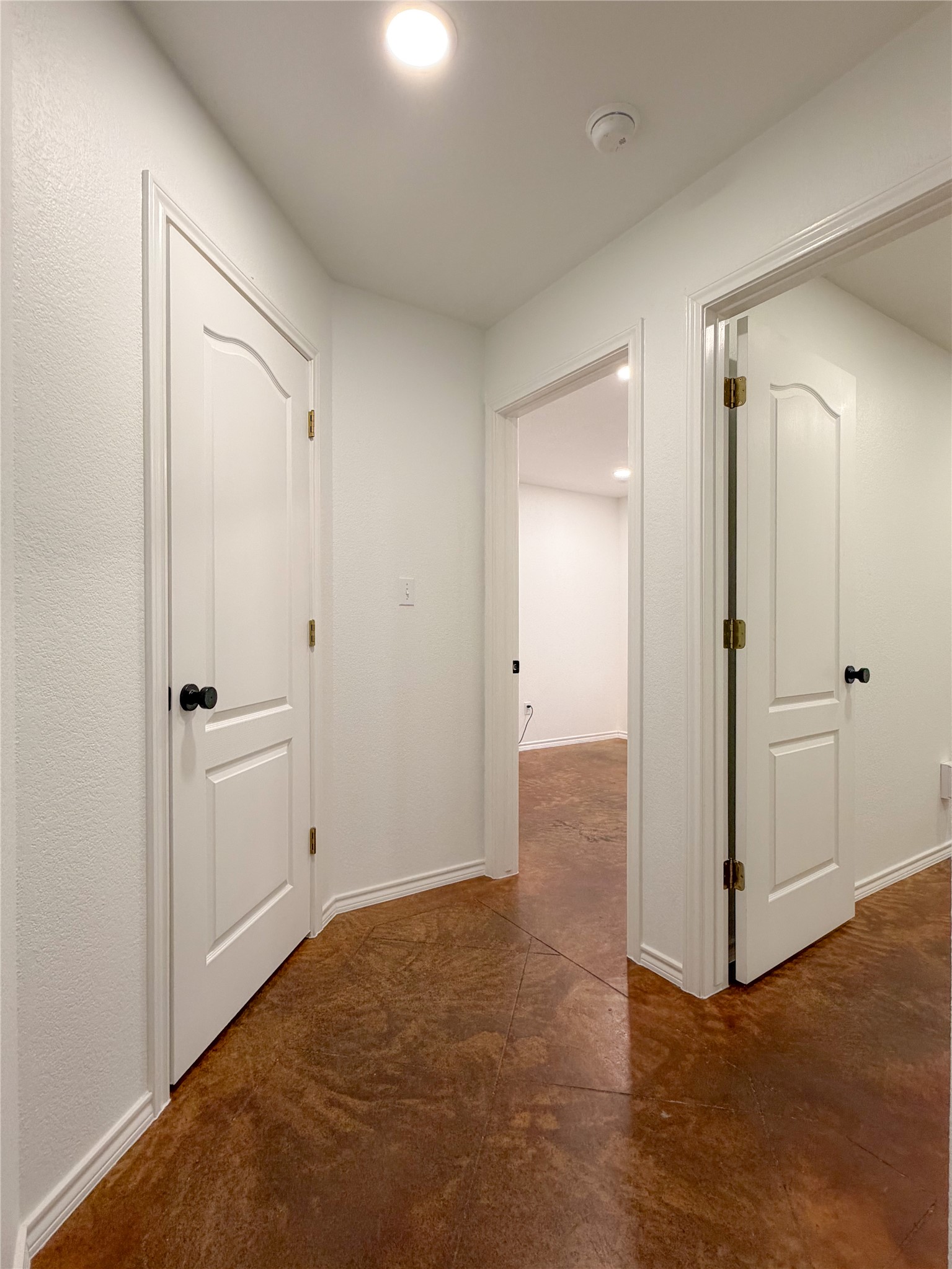 430 Summit Ridge Drive North Point Venture, TX 78645 - Photo 23 of 39 Hallway with finished concrete floors and baseboards