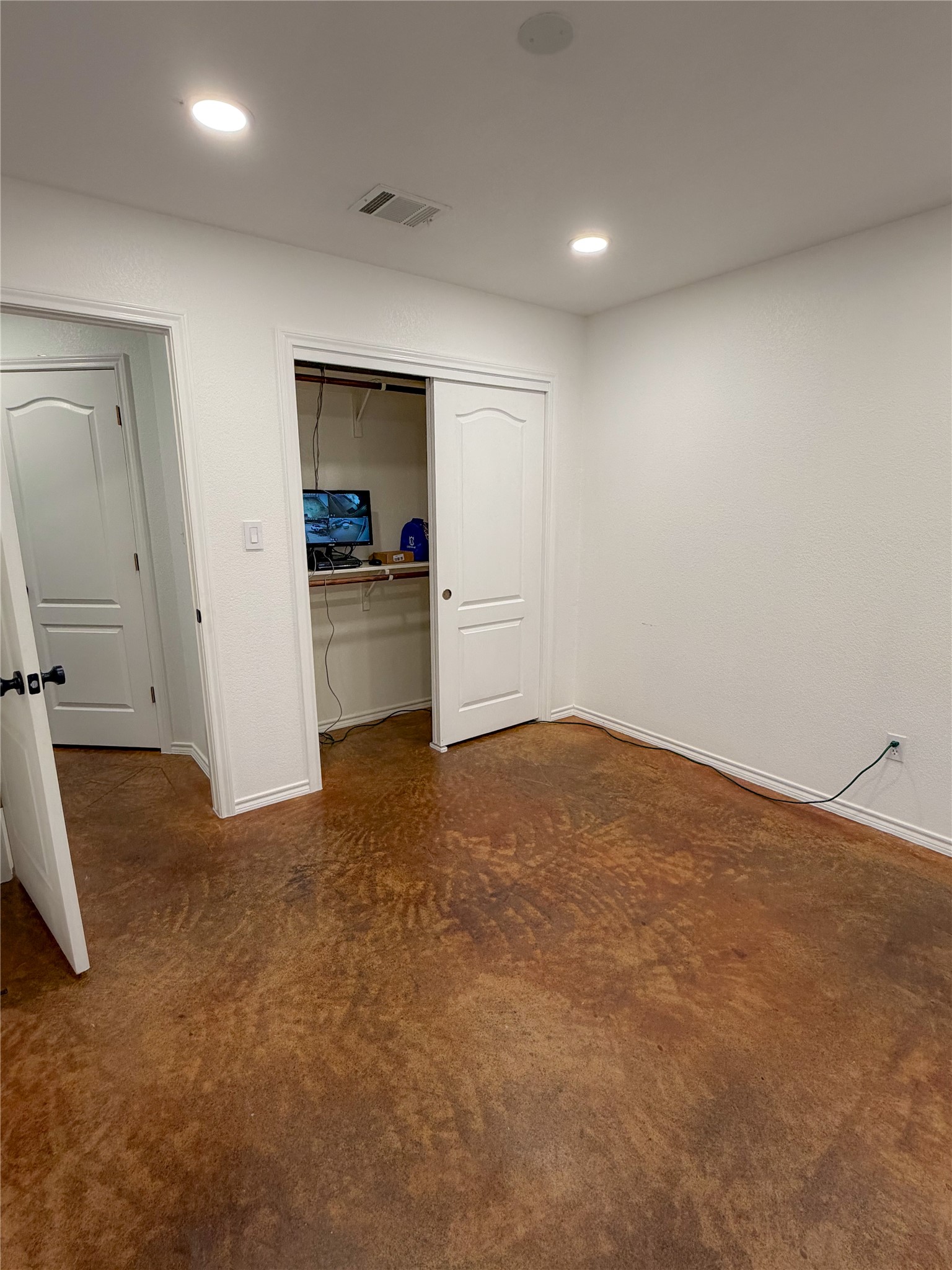 430 Summit Ridge Drive North Point Venture, TX 78645 - Photo 26 of 39 Unfurnished bedroom with dark carpet, a closet, and recessed lighting