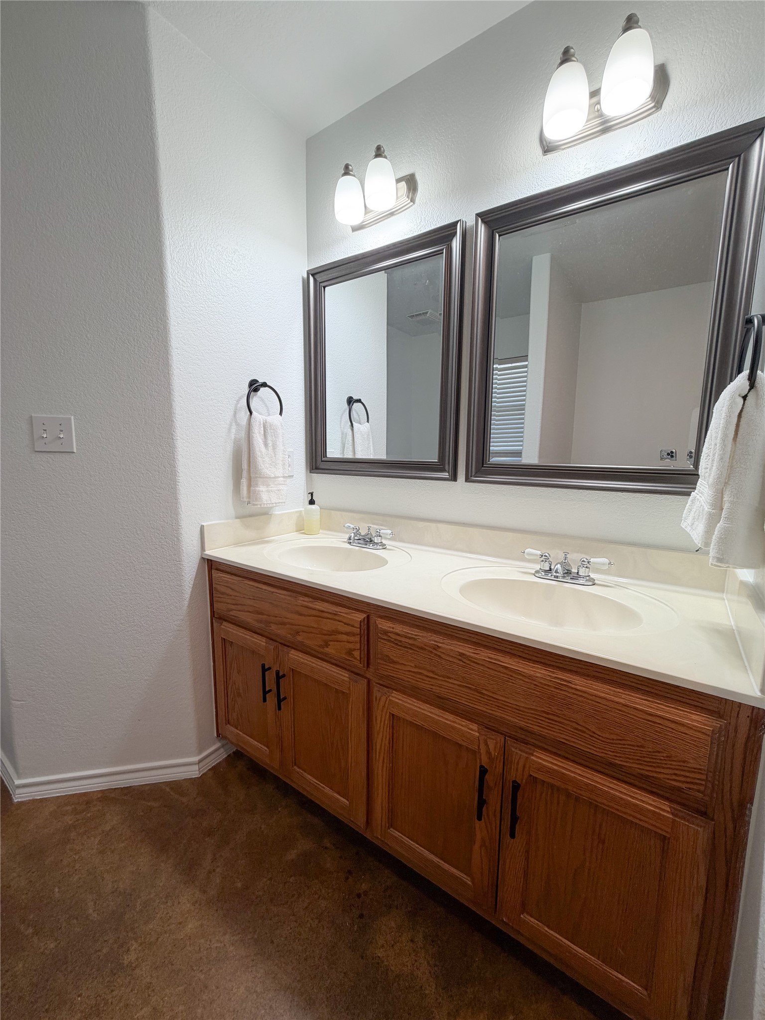 430 Summit Ridge Drive North Point Venture, TX 78645 - Photo 7 of 39 Bathroom featuring double vanity, a textured wall, and dark colored carpet
