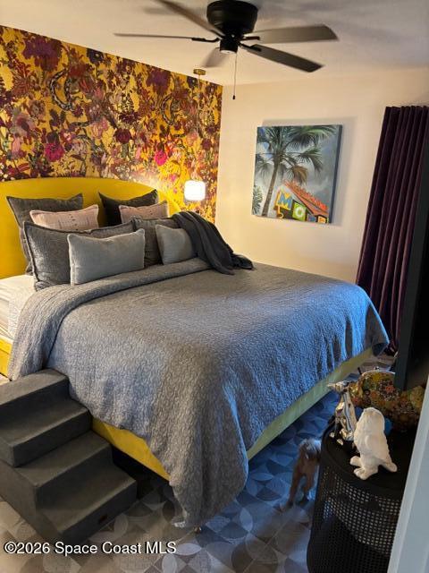 730 Cobblestone Lane Northeast Palm Bay, FL 32905 - Photo 6 of 9 a large bed sitting in a bedroom next to a window