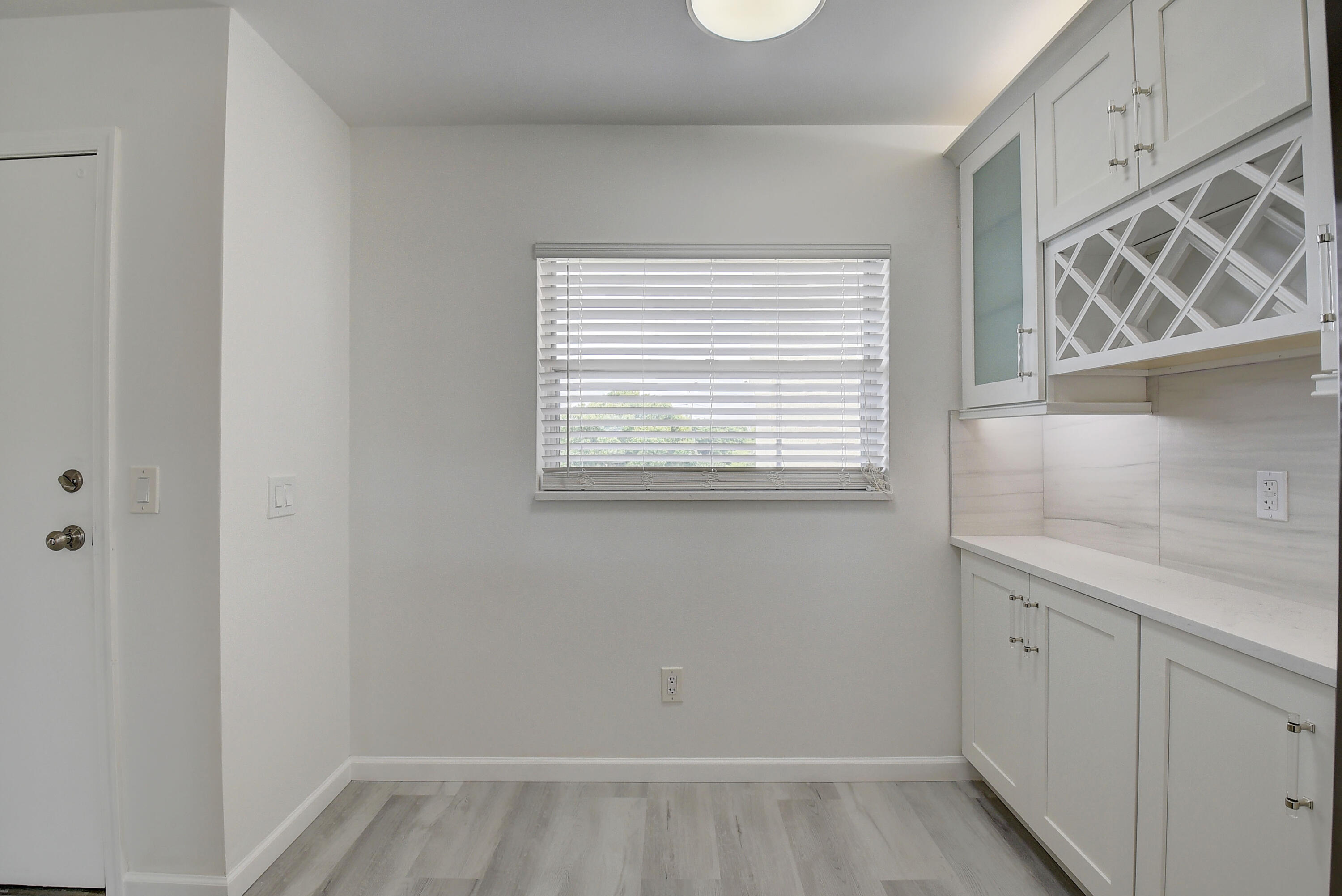 23305 Barwood Lane North, Unit 406 Boca Raton, FL 33428 - Photo 14 of 41 a view of a kitchen that has a sink and a window