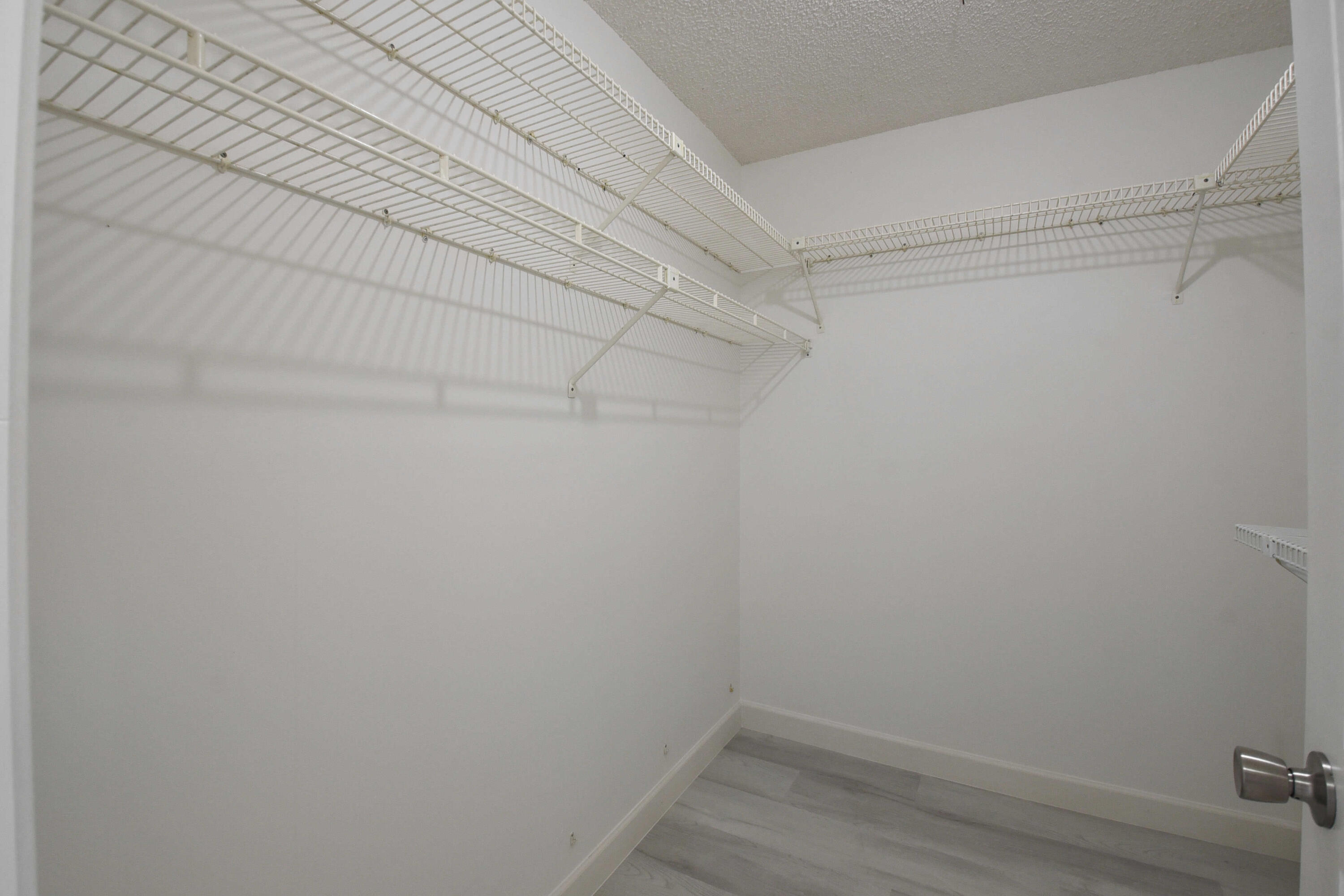 23305 Barwood Lane North, Unit 406 Boca Raton, FL 33428 - Photo 19 of 41 a view of a room with shelf