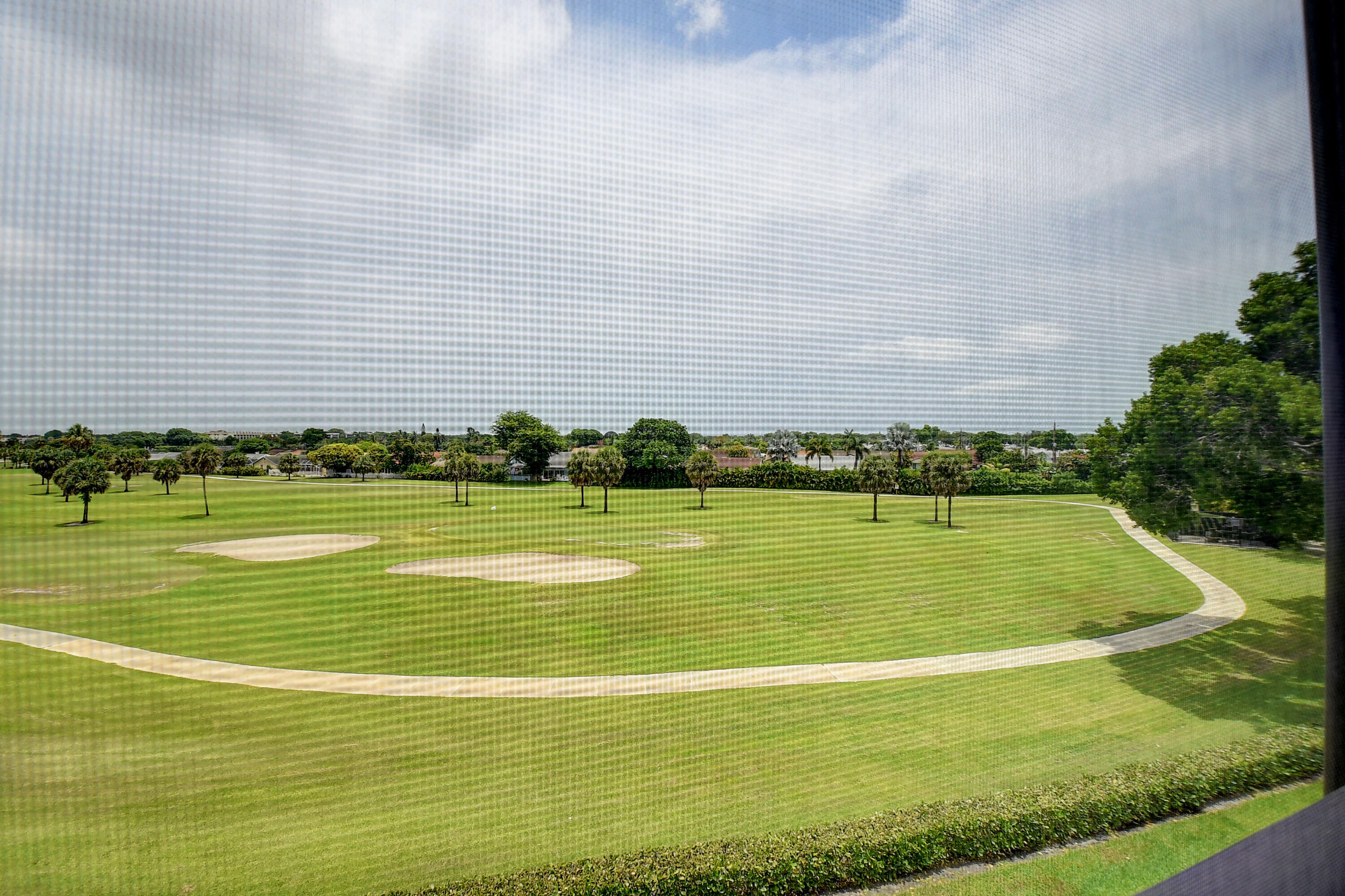 23305 Barwood Lane North, Unit 406 Boca Raton, FL 33428 - Photo 29 of 41 a view of a swimming pool and an outdoor space