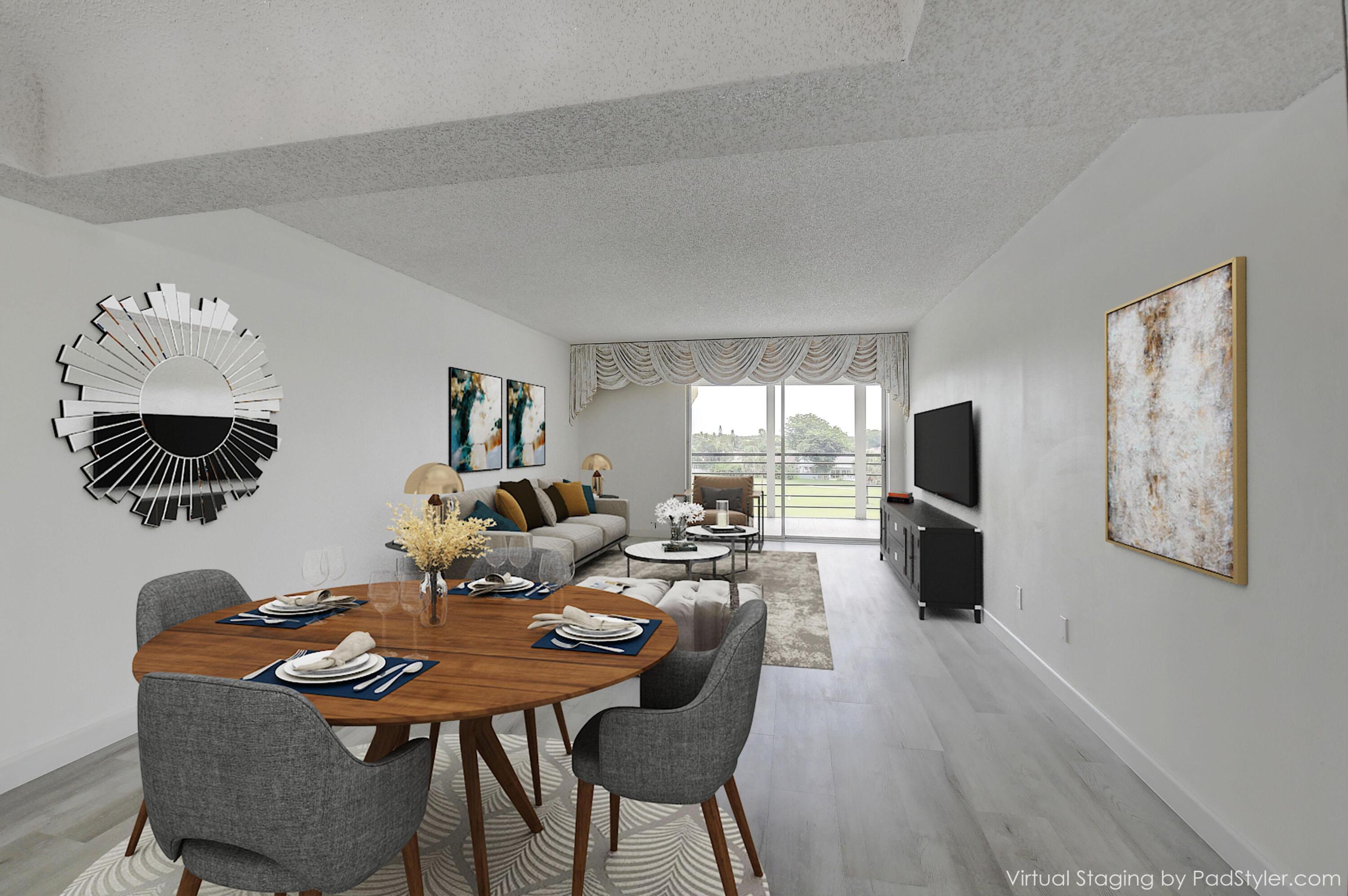 23305 Barwood Lane North, Unit 406 Boca Raton, FL 33428 - Photo 6 of 41 a view of a dining room with furniture and wooden floor
