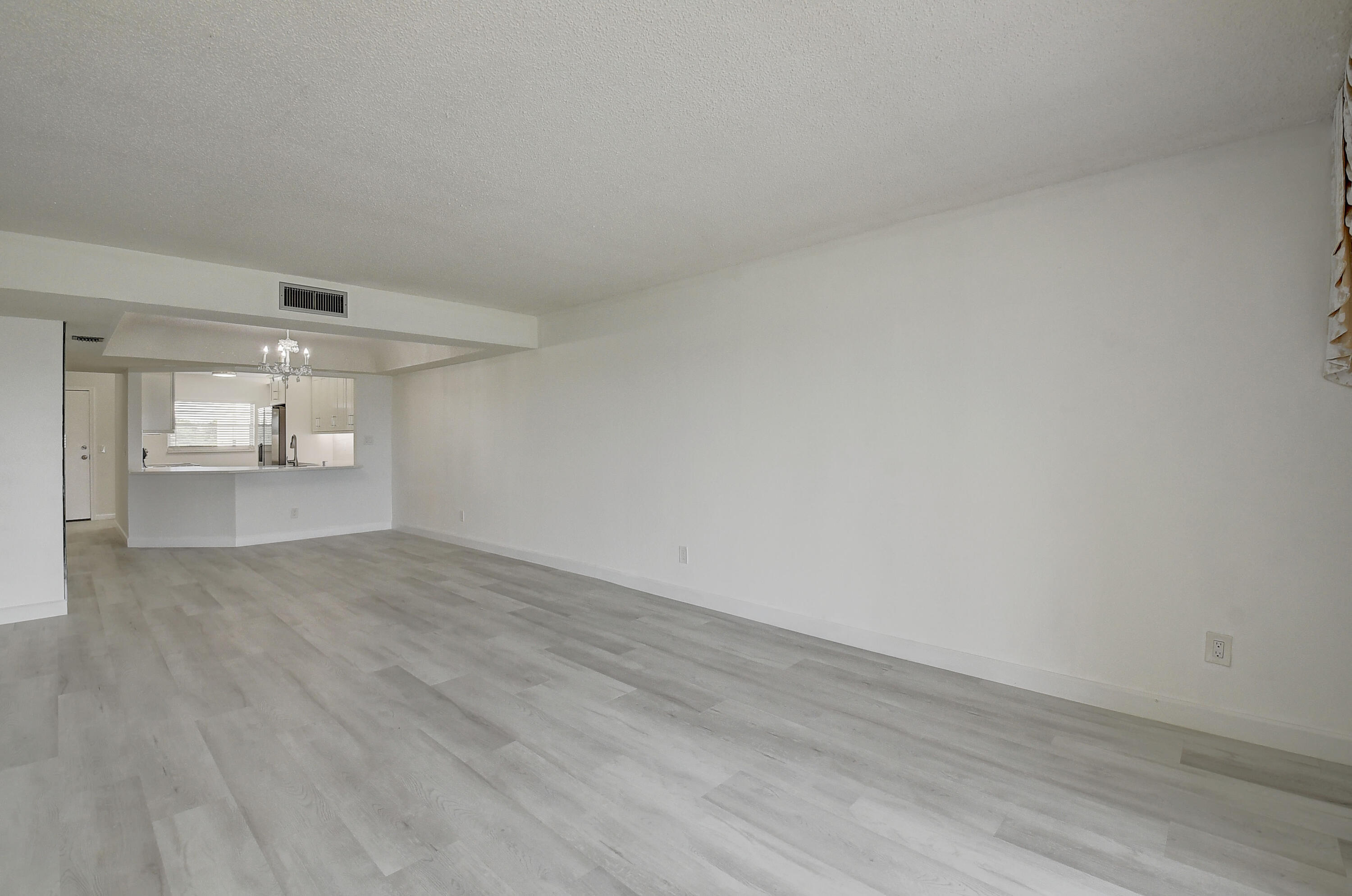 23305 Barwood Lane North, Unit 406 Boca Raton, FL 33428 - Photo 7 of 41 wooden floor in a empty room