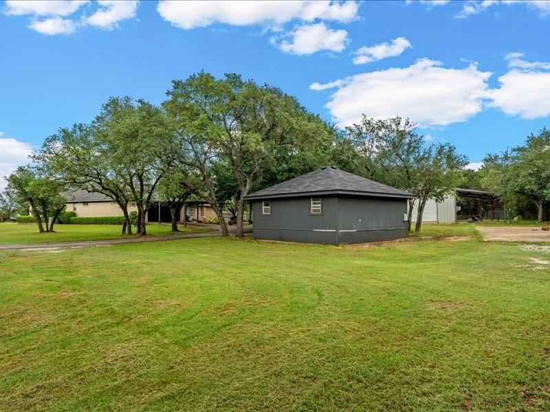 1072 Chapman Road Crawford, TX 76638 - Photo 31 of 39 a front view of a house with a yard