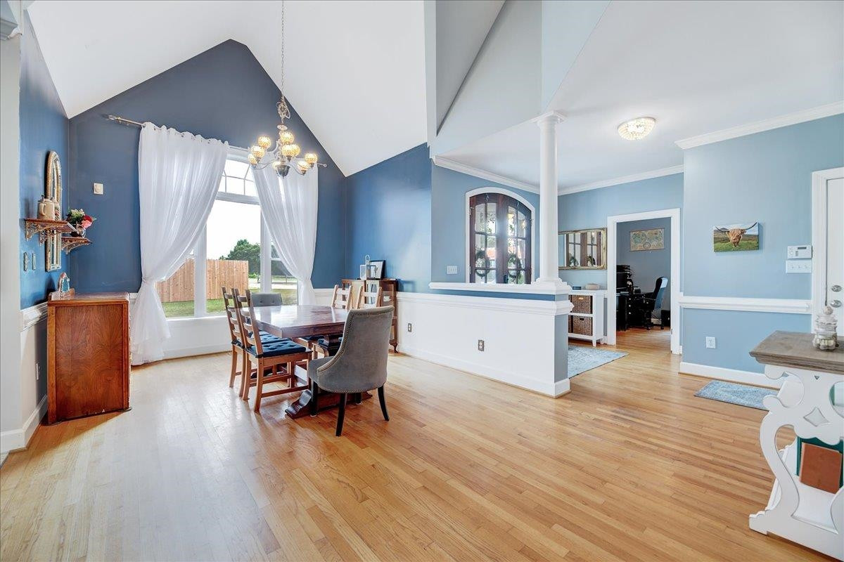 2222 Zacks Mill Road Angier, NC 27501 - Photo 18 of 48 a view of a dining room with furniture and wooden floor