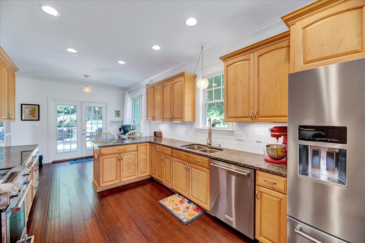 2222 Zacks Mill Road Angier, NC 27501 - Photo 21 of 48 a kitchen with stainless steel appliances granite countertop a sink stove and refrigerator