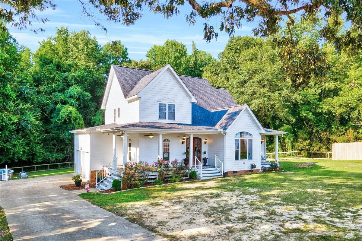 2222 Zacks Mill Road Angier, NC 27501 - Photo 3 of 48 a view of a house with garden and trees
