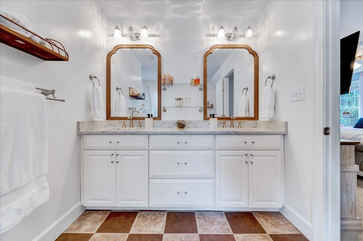 2222 Zacks Mill Road Angier, NC 27501 - Photo 34 of 48 a bathroom with a double vanity sink and mirror