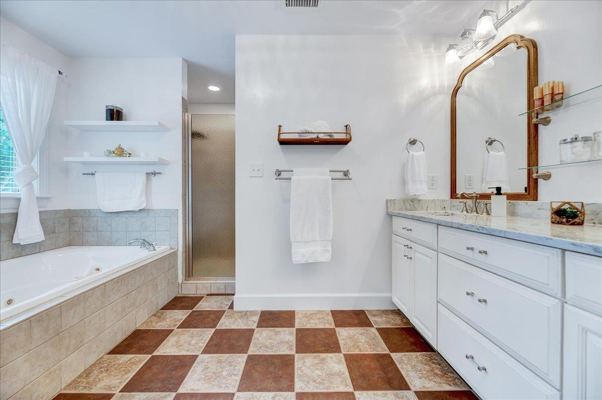 2222 Zacks Mill Road Angier, NC 27501 - Photo 35 of 48 a bathroom with a bathtub and a sink