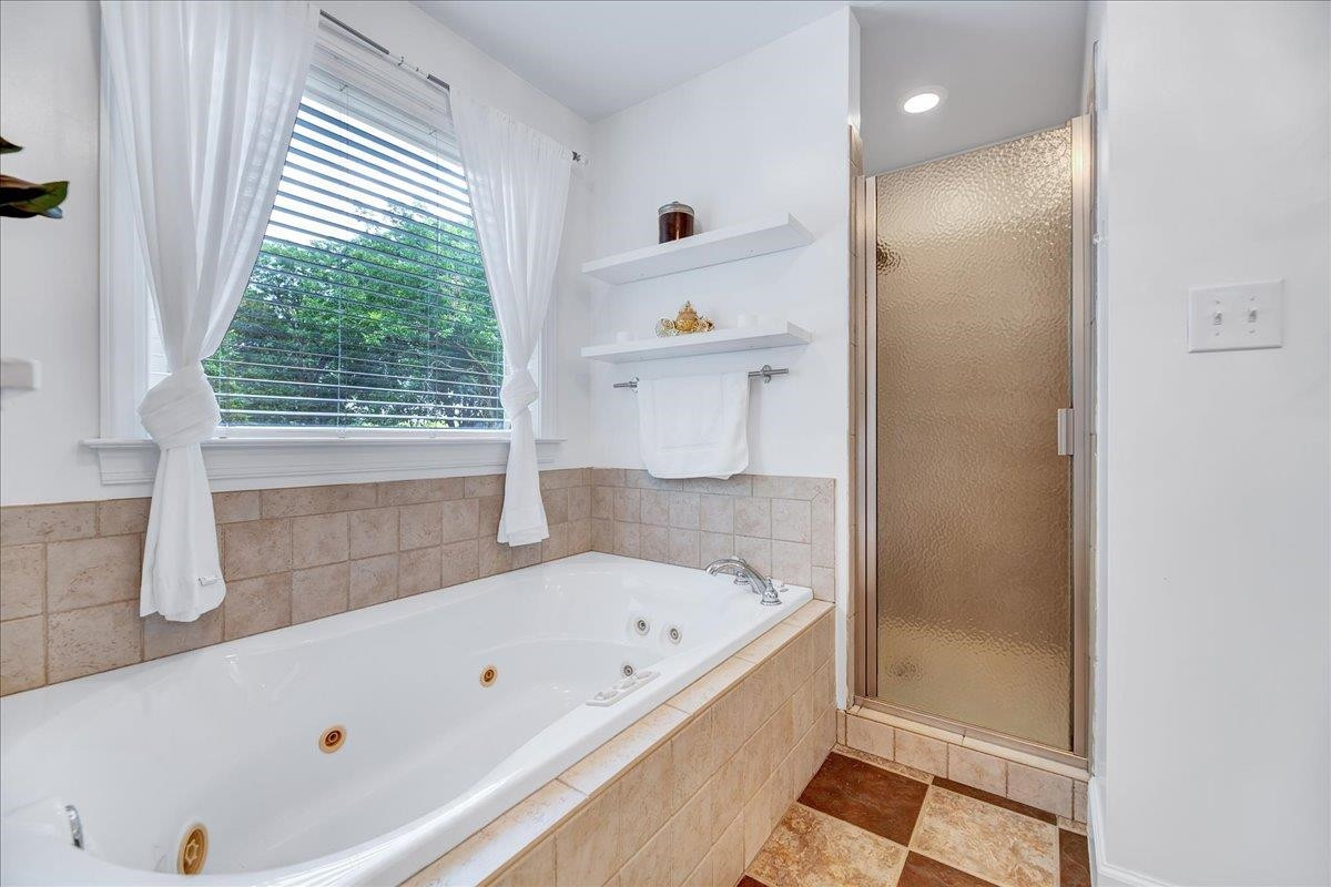 2222 Zacks Mill Road Angier, NC 27501 - Photo 36 of 48 a bathroom with a bathtub and a shower