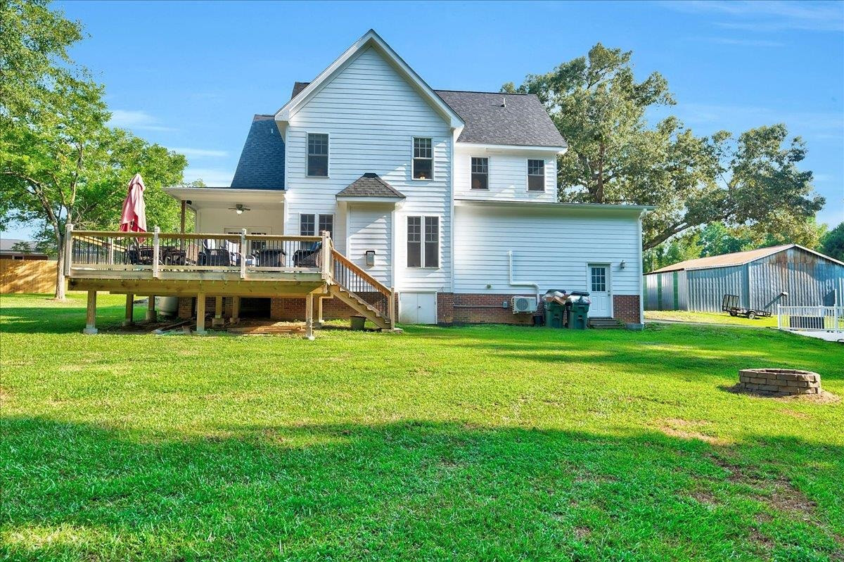 2222 Zacks Mill Road Angier, NC 27501 - Photo 6 of 48 a front view of a house with a yard and trees