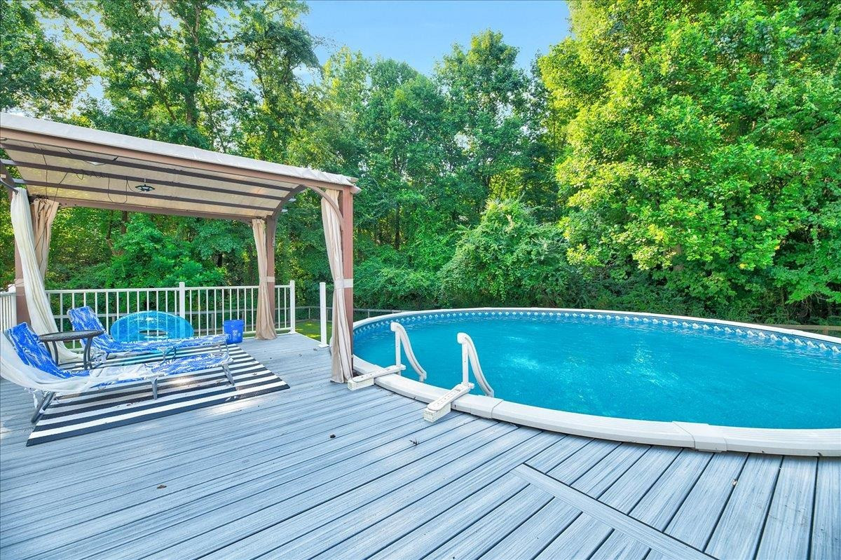 2222 Zacks Mill Road Angier, NC 27501 - Photo 10 of 48 a view of deck with a large window and wooden floor