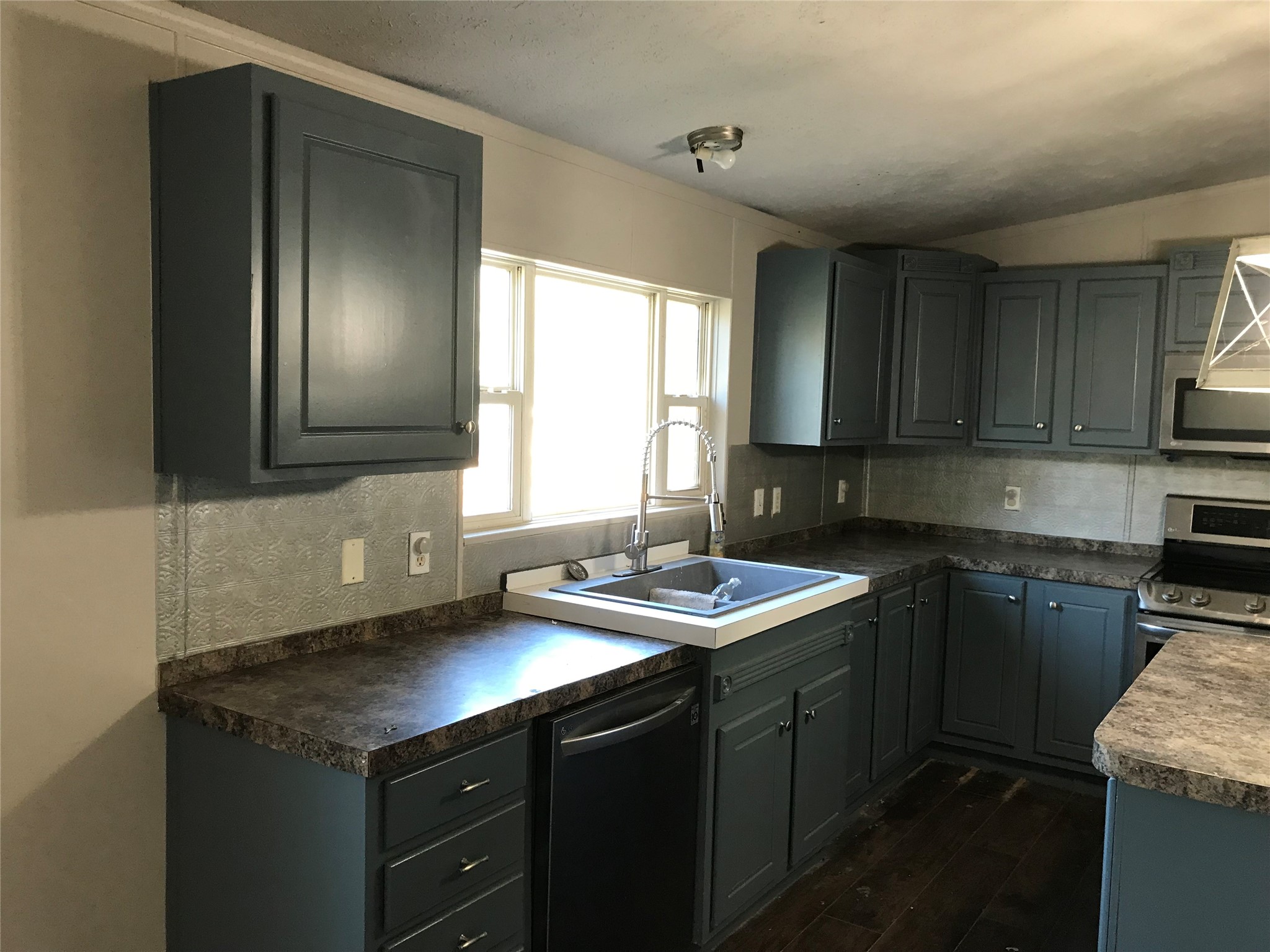 31606 Bryan Street Magnolia, TX 77355 - Photo 3 of 19 a kitchen with a sink cabinets and window