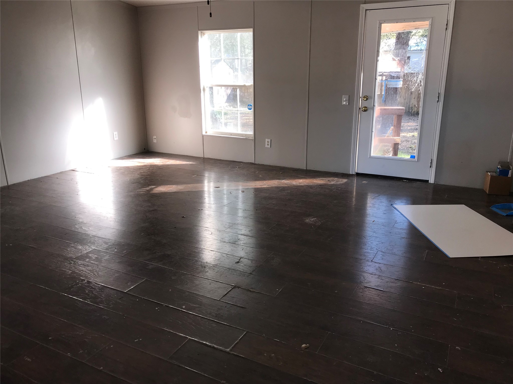 31606 Bryan Street Magnolia, TX 77355 - Photo 7 of 19 an empty room with wooden floor and windows