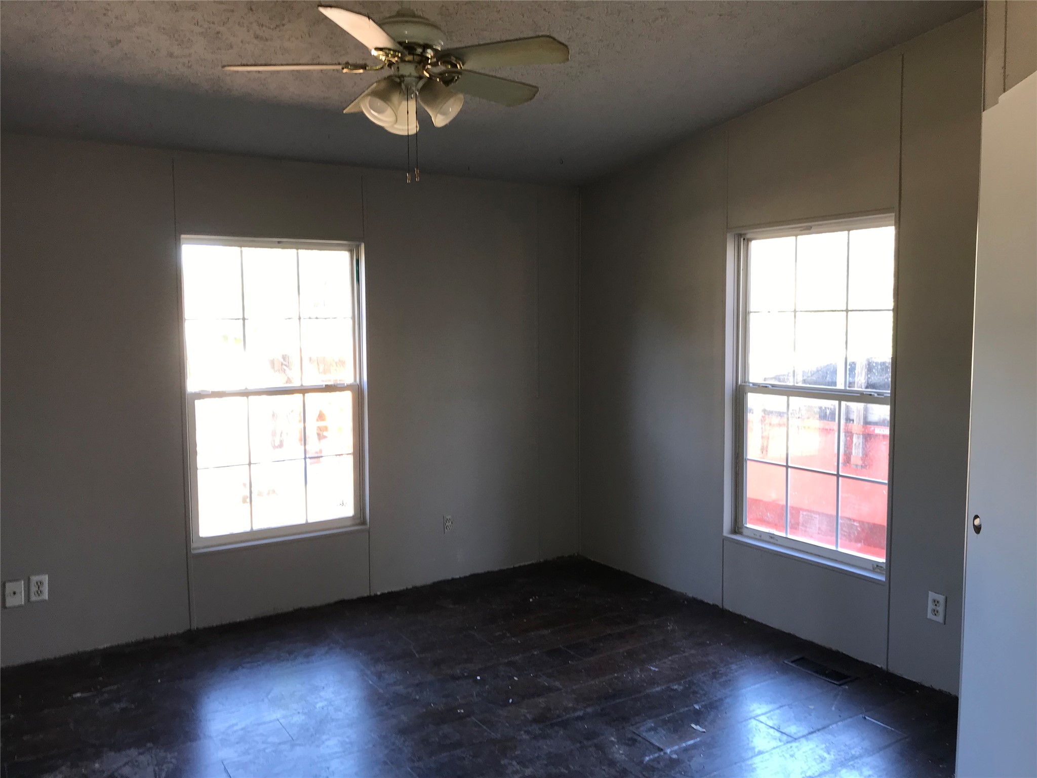 31606 Bryan Street Magnolia, TX 77355 - Photo 8 of 19 a view of an empty room with wooden floor and a window