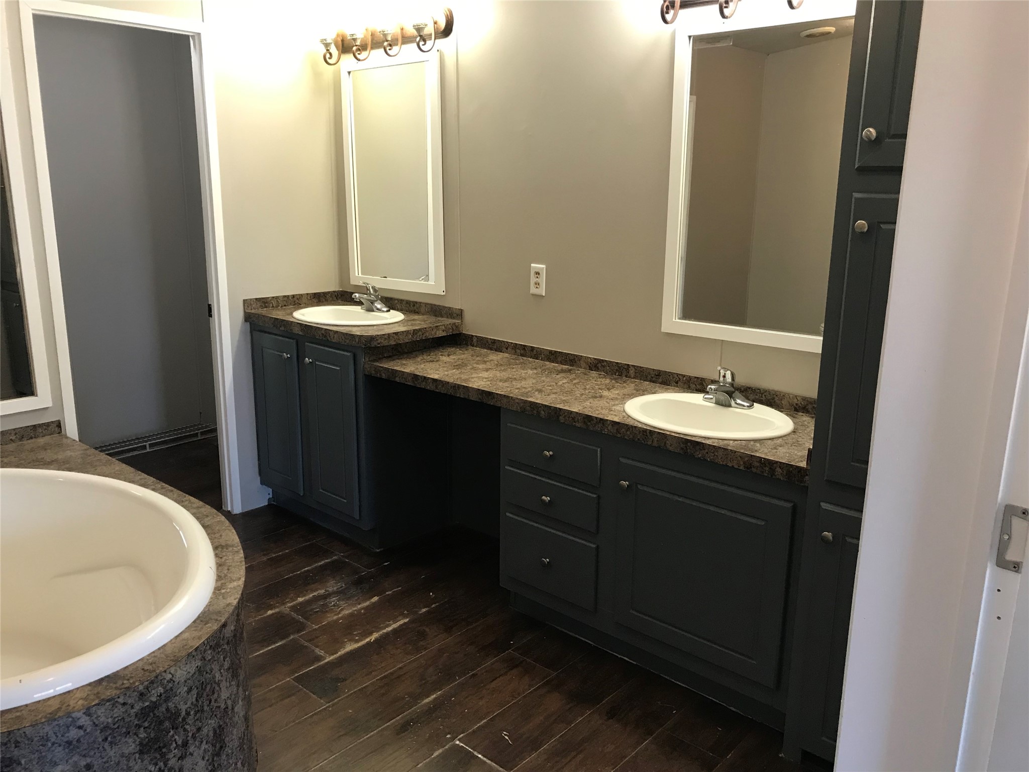 31606 Bryan Street Magnolia, TX 77355 - Photo 9 of 19 a bathroom with a granite countertop sink and a mirror