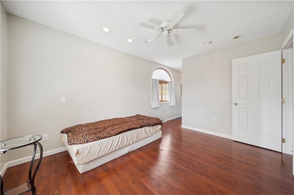 1512 Abers Creek Road Pittsburgh, PA 15239 - Photo 14 of 39 a living room with furniture and a wooden floor