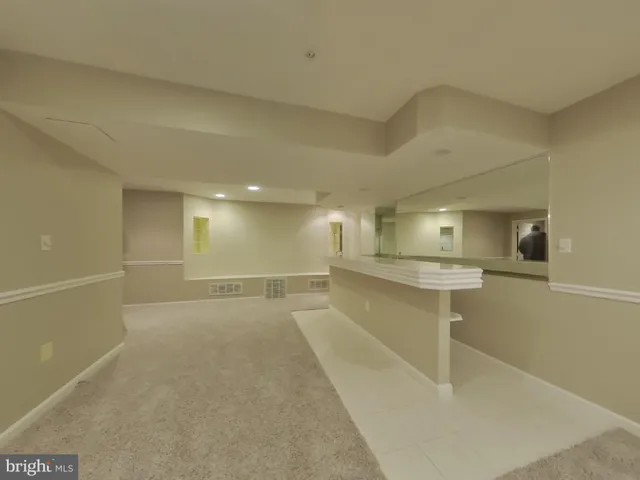 a view of a room with table and chairs