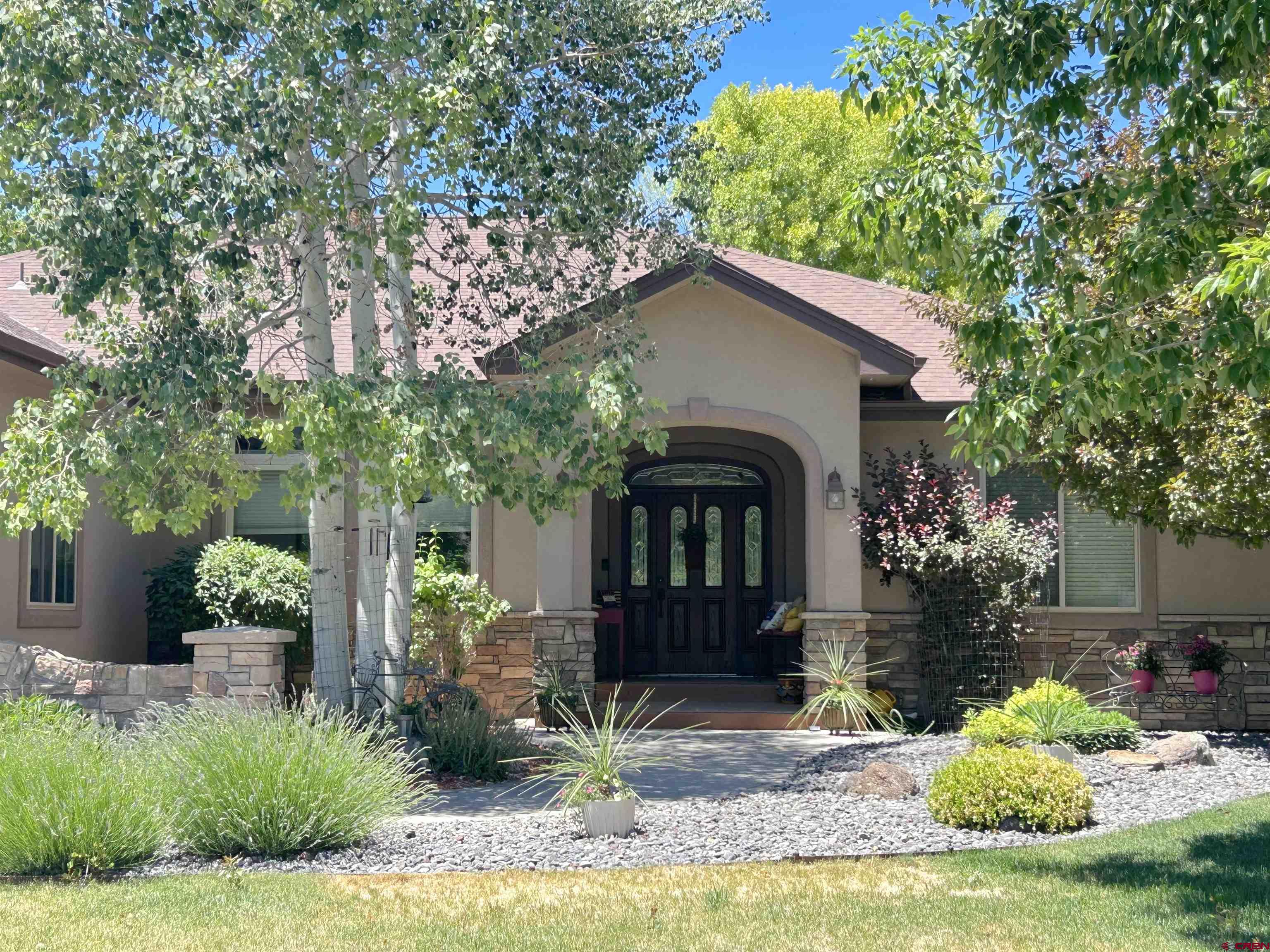 850 Southeast Pinyon Street Cedaredge, CO 81413 - Photo 2 of 45 a front view of a house with garden