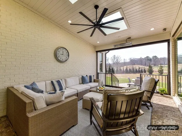 a spacious bedroom with a bed and a large window