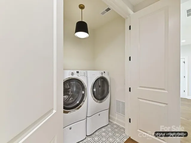 a front view of a house with a yard fire pit and outdoor seating