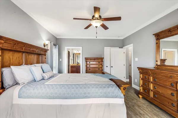 a bedroom with a large bed and furniture