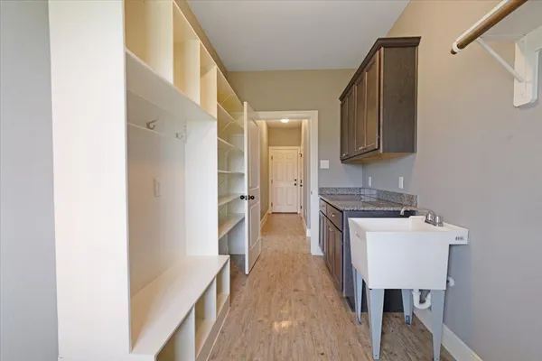 a kitchen with a cabinets and a sink