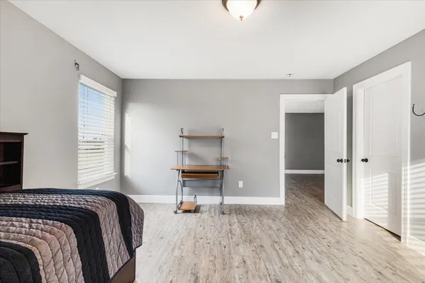 a bedroom with a bed and a dresser