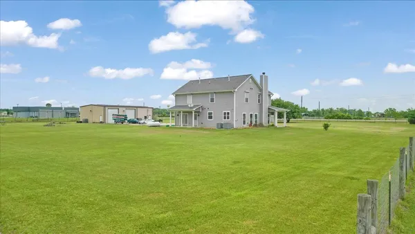 a view of a house with a big yard