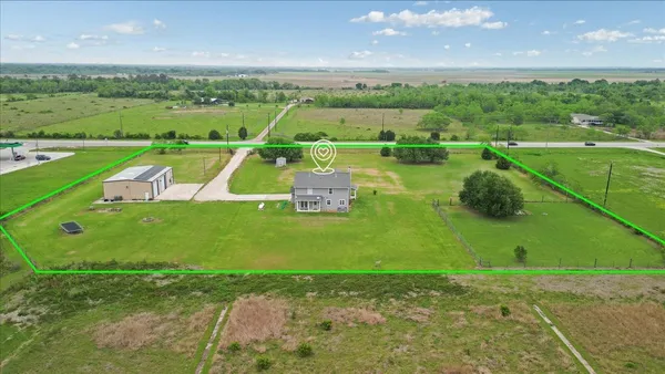 an aerial view of a golf course with a big yard