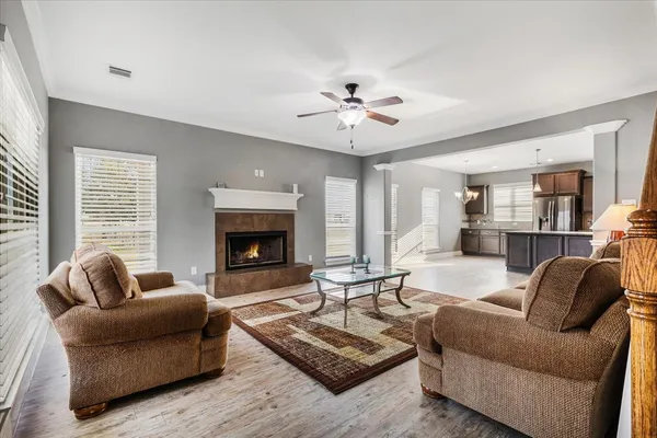 a living room with furniture and a fireplace