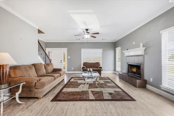 a living room with furniture and a fireplace