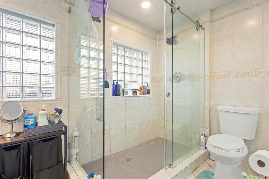 10344 Dorchester Drive Boca Raton, FL 33428 - Photo 14 of 30 a bathroom with a sink toilet and shower