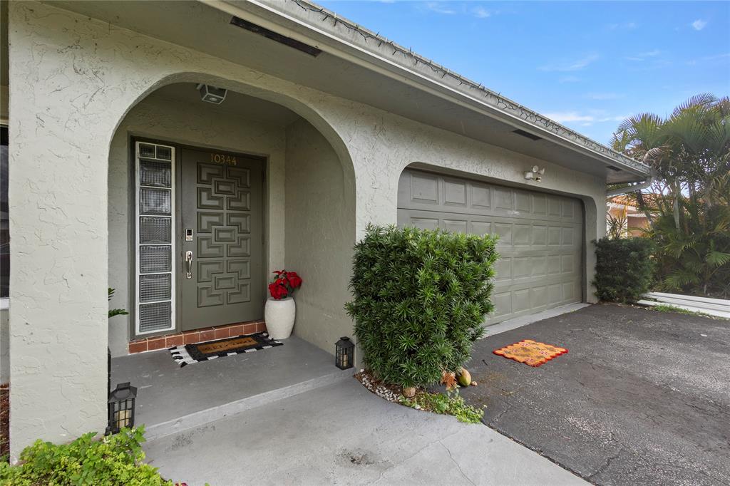 10344 Dorchester Drive Boca Raton, FL 33428 - Photo 2 of 30 a front view of a house