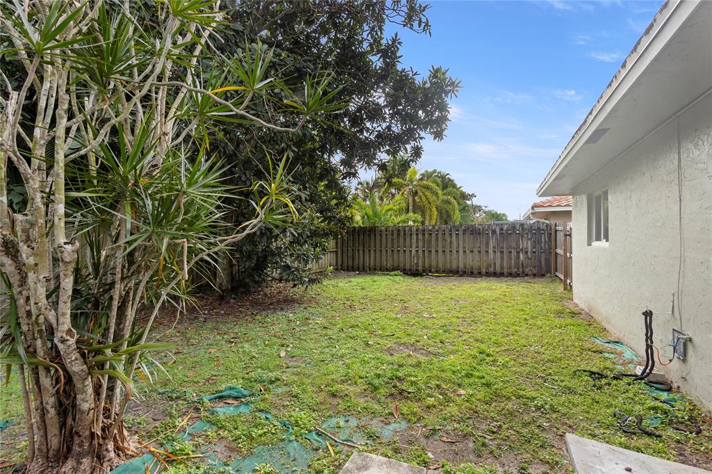10344 Dorchester Drive Boca Raton, FL 33428 - Photo 23 of 30 a view of a backyard