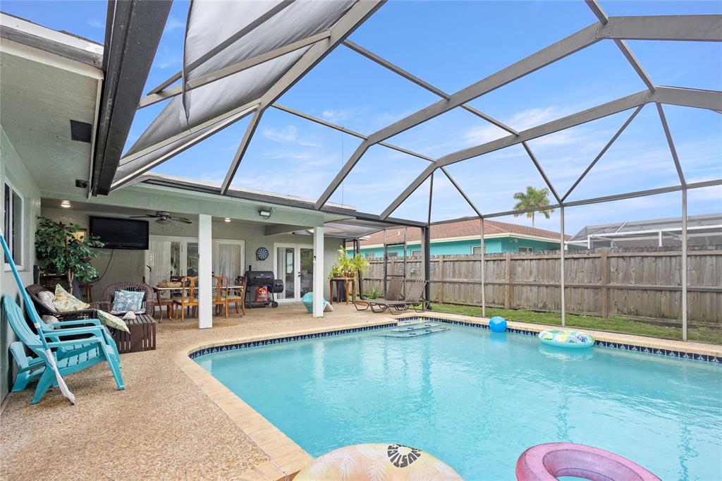 10344 Dorchester Drive Boca Raton, FL 33428 - Photo 24 of 30 a swimming pool with view of outdoor seating