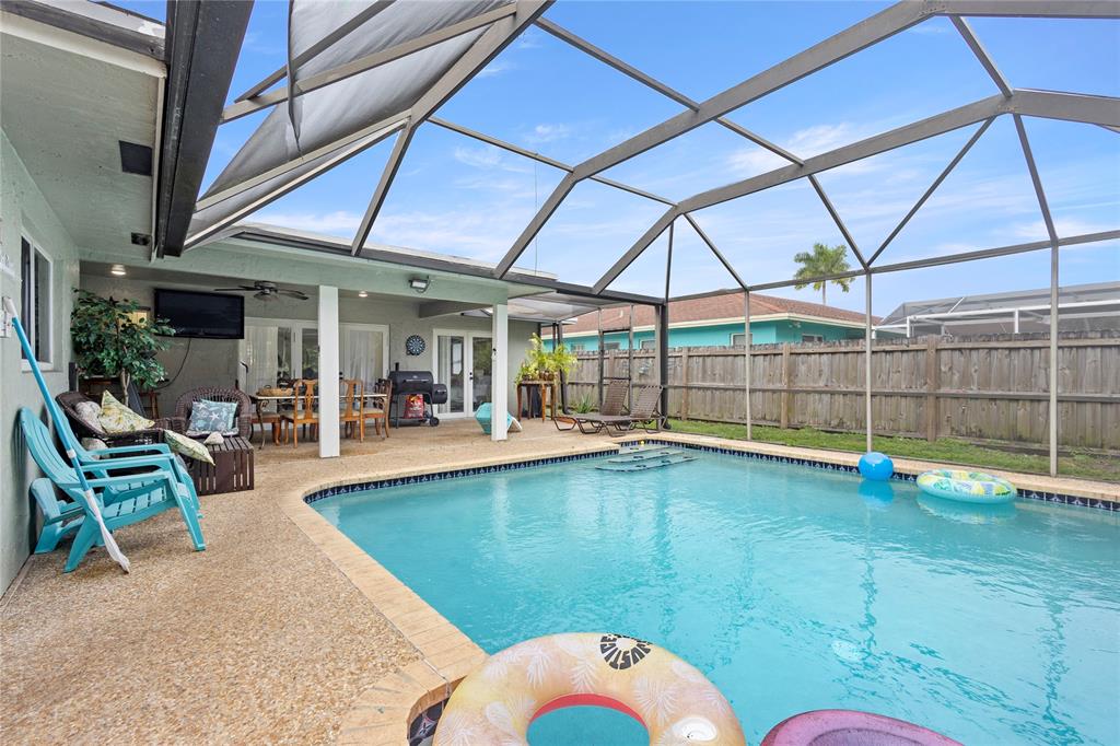 10344 Dorchester Drive Boca Raton, FL 33428 - Photo 26 of 30 a view of a swimming pool with a patio
