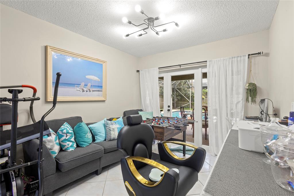 10344 Dorchester Drive Boca Raton, FL 33428 - Photo 6 of 30 a living room with furniture and a large window