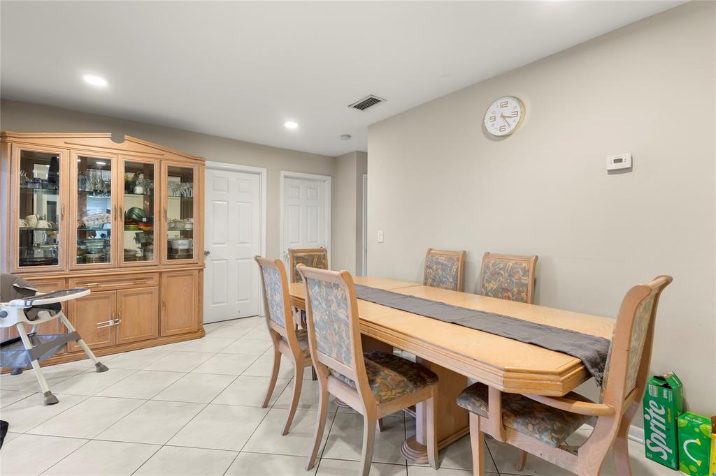 10344 Dorchester Drive Boca Raton, FL 33428 - Photo 9 of 30 a view of a dining room with furniture and window