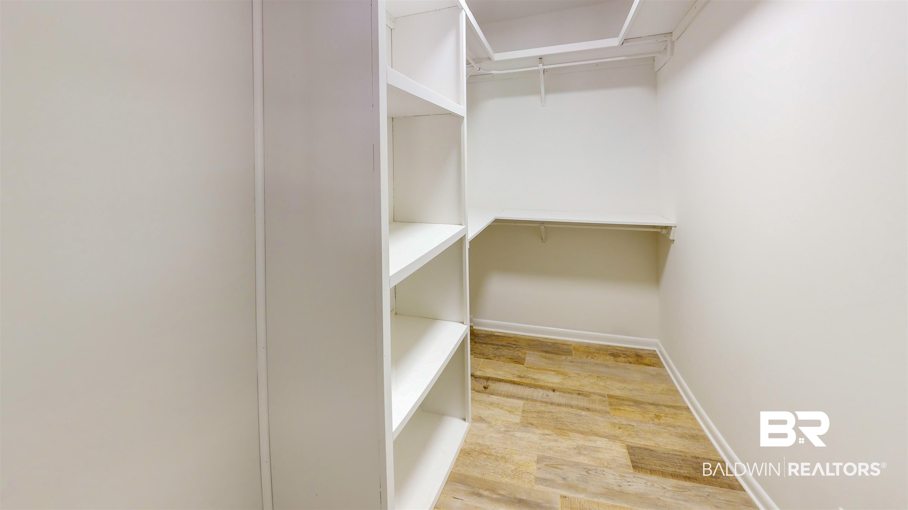 22711 Highway 98 Foley, AL 36535 - Photo 17 of 74 Walk in closet featuring light wood finished floors